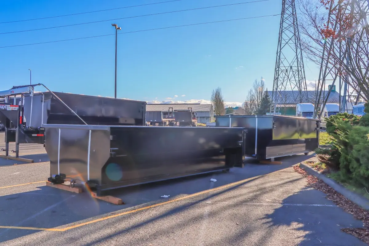 Roll-off dumpster ready for waste disposal at job site for Roofing Dumpster Rental in Pittsfield